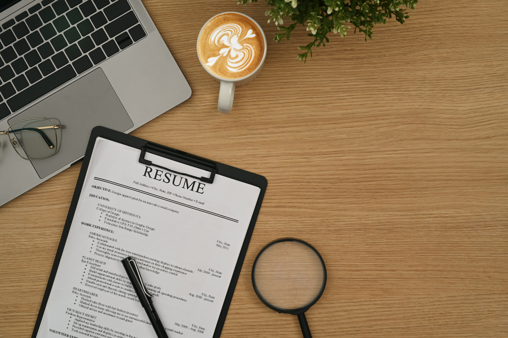 Resume forms or CV and laptop computer on wooden table. Career,